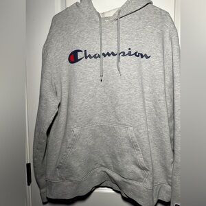 This is a slightly worn, gray champion sweatshirt, sizing extra large.